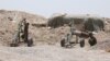 Fighters of the Syria Democratic Forces prepare to fire a mortar shell towards positions held by Islamic State fighters in northern province of Raqqa, Syria, May 27, 2016.