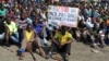 Striking Lonmin Platinum miners gather in Marikana, South Africa, where a new wage offer was rejected, Sept. 14, 2012. 