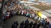 Liberian security forces stand in front of protesters after clashes at West Point neighbourhood in Monrovia, August 20, 2014.