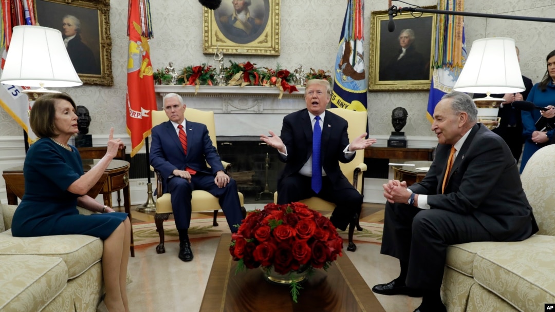 President Donald Trump and Vice President Mike Pence meet with Senate Minority Leader Chuck Schumer, D-N.Y., and House Minority Leader Nancy Pelosi, D-Calif., in the Oval Office of the White House, Tuesday, Dec. 11, 2018, in Washington. 