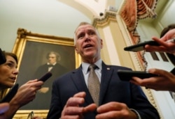 FILE - U.S. Senator Thom Tillis (R-NC) talks to reporters at the U.S. Capitol in Washington, Jan. 30, 2020.