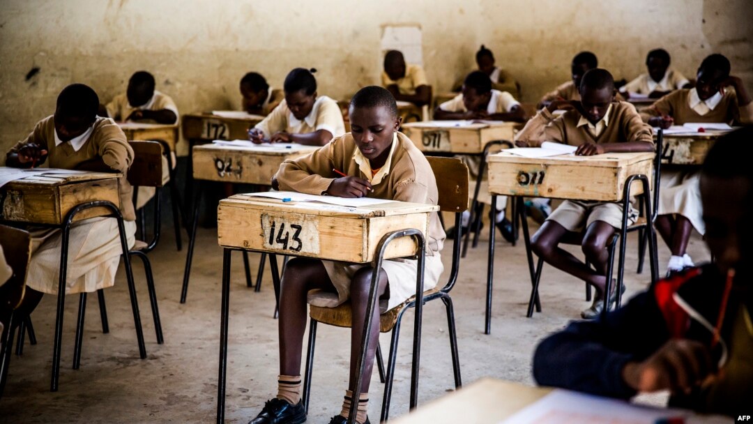 FILE - Pupils from the Mathare North Primary School take the Kenya Certificate of Primary Education (KCPE) exam.