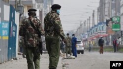 FILE - Kenyan police patrol in Eastleigh, Nairobi, on May 7, 2020. 