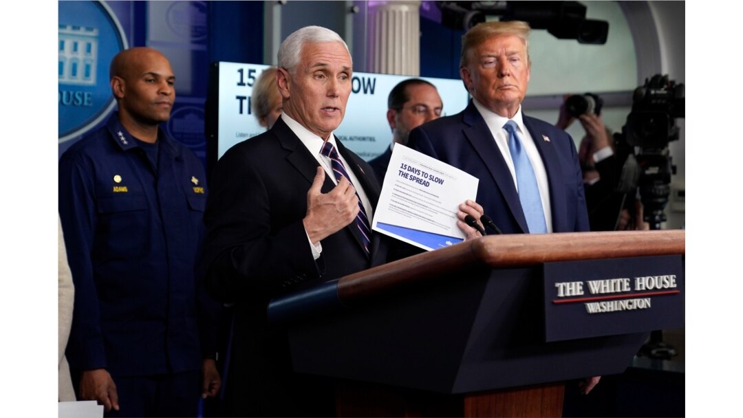 Vice President Mike Pence speaks as President Donald Trump listens during a press briefing with the coronavirus task force, at the White House, March 16, 2020, in Washington.