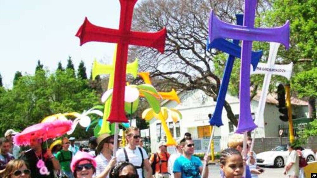 FILE - Many opponents of homosexuality say being gay is anti-Christian… But many gays, including these protesting in South Africa, say they’re Christians as well.