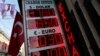 A board showing the currency exchange rates of the U.S. dollar and the Euro against Turkish lira is on display at a currency exchange office in Istanbul, Jan. 12, 2017.