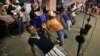 FILE - Youths dance in the a rap band entertaining meeting of the National Youth Council, Jan. 4, 2013. In Cameroon, authorities are banning the sale or broadcast of some popular music including a new dance hit by the prominent Cameroonian rapper, Franko.