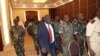 Michel Djotodia, center, rebel leader who declared himself president, arrives for meetings with government armed forces, Bangui, Central African Republic, March 28, 2013.