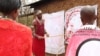 Trachoma monitor Lester Mortai teaches a group women how to prevent Trachoma at household level in Kajiado, Kenya. (Mohammed Yusuf/VOA)