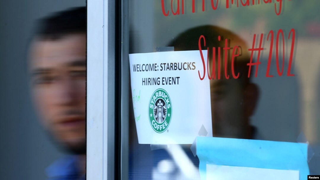 FILE - A refugee leaves a job interviews with Starbucks as the company takes part in a corporate commitment to globally hire 10,000 refugees, in El Cajon, California, Aug. 8, 2017.