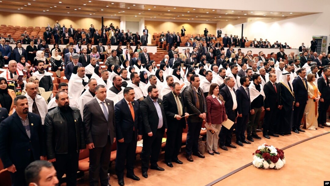 Newly elected lawmakers attend the first parliament session in Baghdad, Iraq, Jan. 9, 2022. 