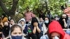 Afghan nationals react at a gathering to urge the international community to help Afghan refugees, in New Delhi, India, August 18, 2021. 