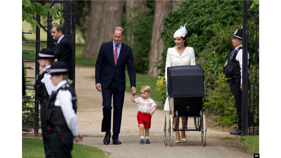 Britain's Prince William, Kate the Duchess of Cambridge, their son Prince George and daughter Princess Charlotte in a pram arrive for Charlotte's Christening at St. Mary Magdalene Church in Sandringham, England, July 5, 2015.