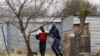 A man is arrested by police at Lonmin's Marikana mine in South Africa's North West Province, September 15, 2012. 