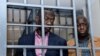 Mpinzani mkongwe wa Rais Museveni Kizza Besigye na mwenzake Obeid Lutale wakiwa katika mahakama ya kijeshi katika kitongoji cha Kampala cha Makindye, Novemba 20, 2024. Picha ya Reuters