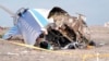 FILE - In this photo taken from a video released by the administration of Mangystau region, the wreckage of Azerbaijan Airlines Embraer 190 lies on the ground near the airport of Aktau, Kazakhstan, Dec. 25, 2024. 