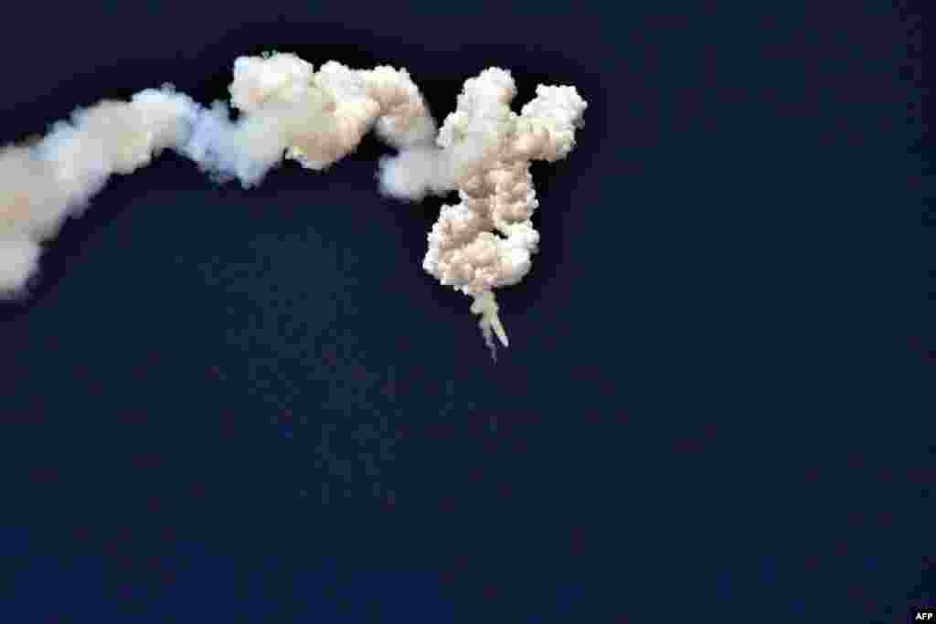 This undated picture released by North Korea's official Korean Central News Agency (KCNA) shows ground-to-ground medium-to-long range strategic ballistic missile Pukguksong-2 during its test-fire.
