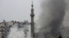 Smoke rises from a mosque and another building during heavy fighting between the Free Syrian Army and President Bashar al-Assad's forces, in the Jobar area of Damascus Feb. 6, 2013. 