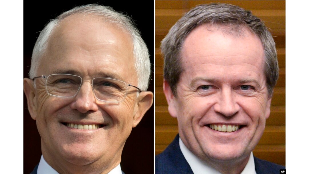 FILE - This combination of file photos from April 15, 2016, and July 8, 2014, shows Australian Prime Minister Malcolm Turnbull, left, and Australian opposition leader Bill Shorten.