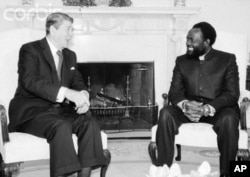FILE - Jonas Savimbi, right, meets with U.S. President Ronald Reagan at the White House in 1985.