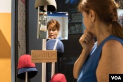 Randa Tabbah checks out Boshies in a shop in Beirut's Achrafieh district. (J. Owens/VOA)