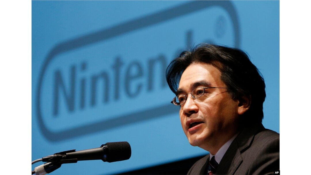 FILE - In this Jan. 31, 2013 file photo, Nintendo Co. President Satoru Iwata speaks during a news conference in Tokyo.