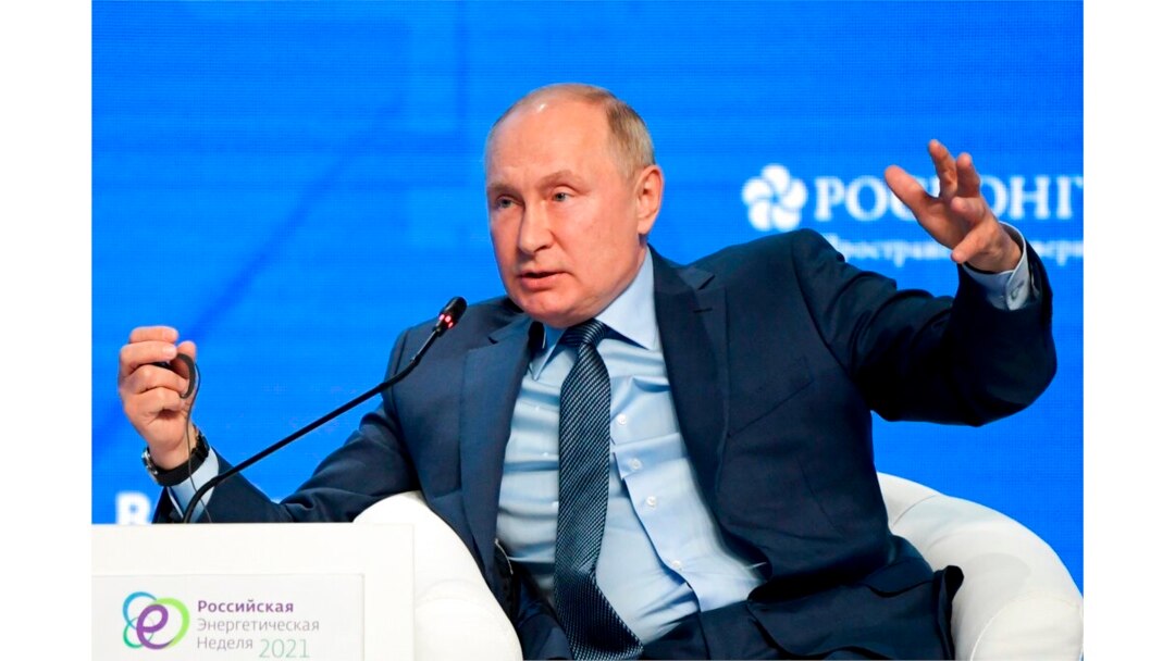 FILE - Russian President Vladimir Putin gestures while speaking at the plenary session of the Russian Energy Week in Moscow, Russia, Oct. 13, 2021.