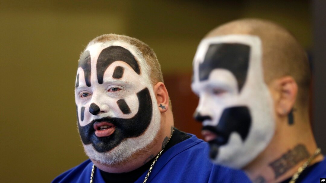 FILE - Joseph Bruce, aka Violent J, left, and Joseph Utsler, aka Shaggy 2 Dope, members of the Insane Clown Posse, address the media in Detroit. The rap metal group sued the U.S. Justice Department over a 2011 FBI report that describes the duo's devoted fans, the Juggalos, as a dangerous gang, saying the designation has tarnished their fans' reputations and hurt business.