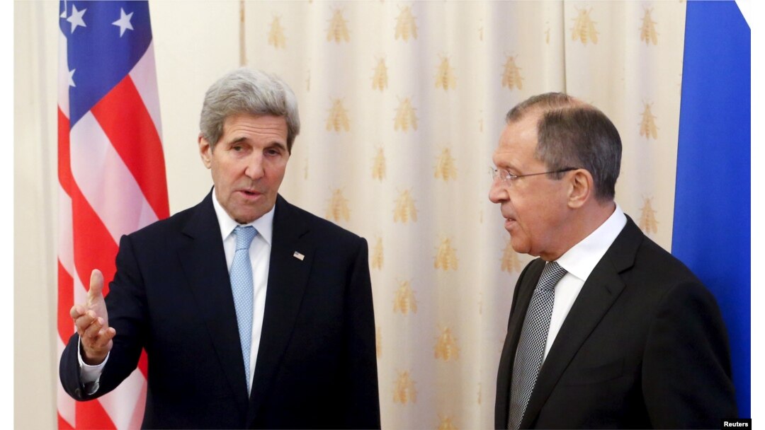 U.S. Secretary of State John Kerry (L) talks to Russian Foreign Minister Sergei Lavrov ahead of a meeting in Moscow, Russia, Dec. 15, 2015.