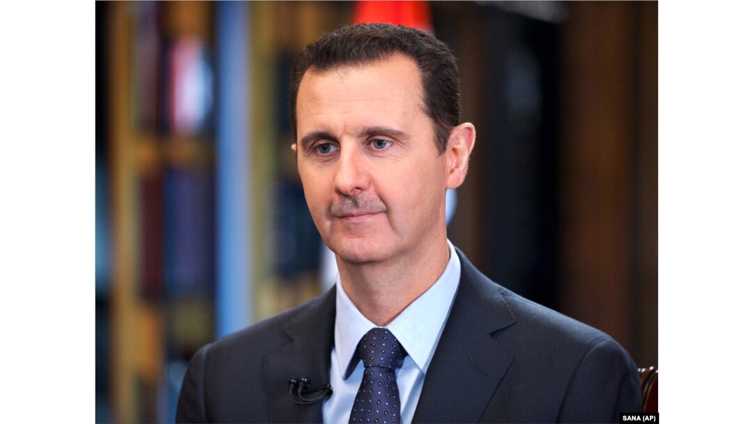 FILE - Syrian President Bashar Assad speaks during an interview with Venezuela's state-run Telesur network, in Damascus, Syria.