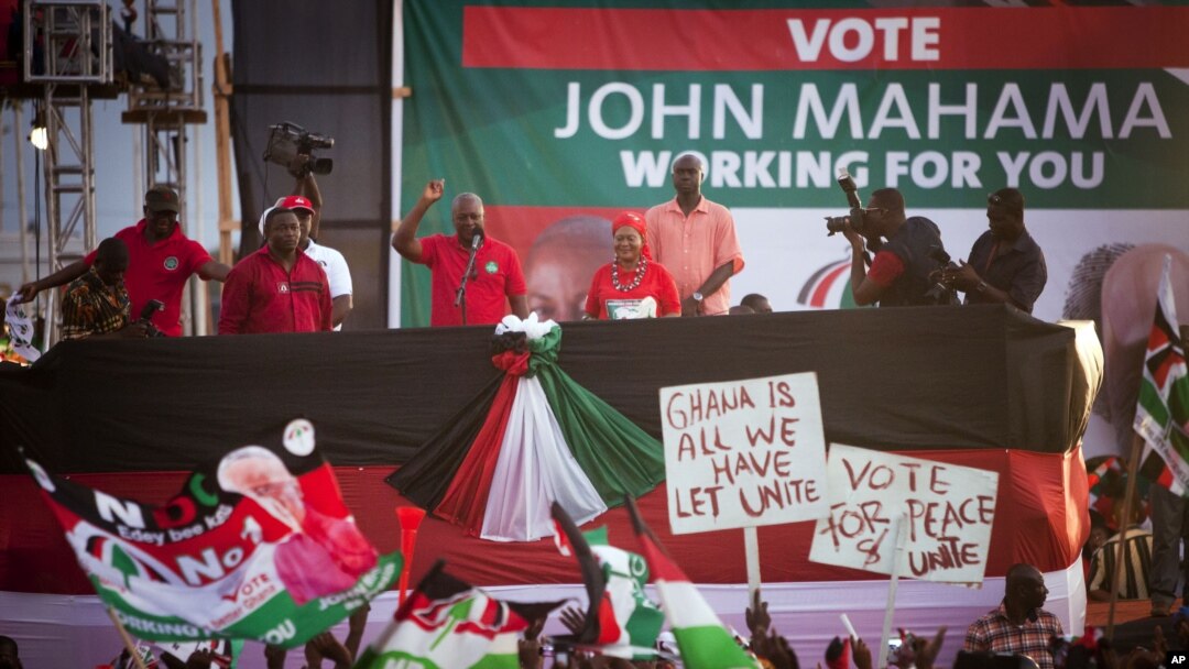 Ghanian President John Dramani Mahama, center left, speaks to supporters at his final campaign rally, in Accra, December 5, 2012.
