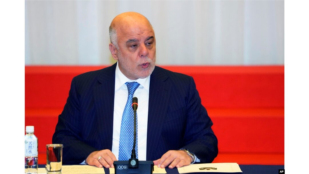 FILE - Iraq's Prime Minister Haider al-Abadi delivers a speech at an economic development conference in Tokyo, April 5, 2018.