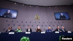 Members of the Pontifical Commission for the Protection of Minors hold a press conference on the release of the panel's first annual report, at the Vatican, Oct. 29, 2024.