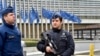 Police patrol the EU commission building, after a bomb exploded nearby, at the subway in Brussels, Belgium, March 22, 2016. 