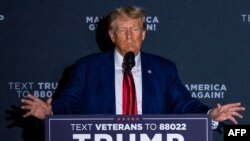 FILE - Former US president and 2024 presidential hopeful Donald Trump speaks during a campaign rally at Windham High School in Windham, New Hampshire, on Aug. 8, 2023.