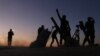 Fighters from the Free Syrian Army cheer and react as they fight against Islamic State group jihadists on the outskirts of the northern Syrian town of Dabiq, Oct. 15, 2016.