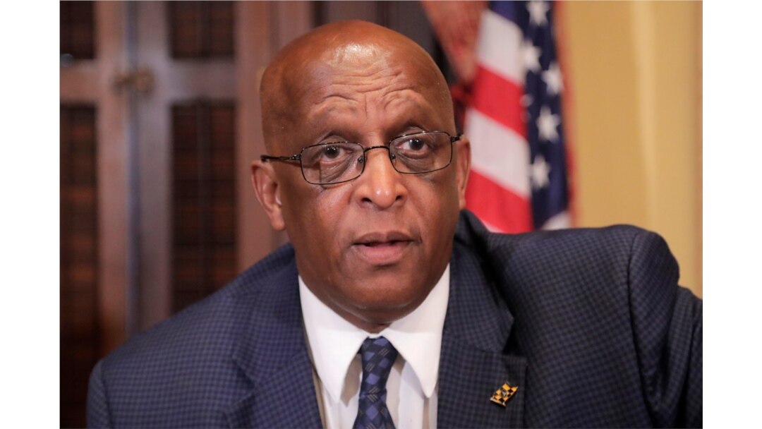 FILE - Baltimore Mayor Bernard "Jack" Young speaks to a supporter following a news conference announcing a new collaboration in an effort to reduce homelessness in Baltimore, July 2, 2019 file photo.