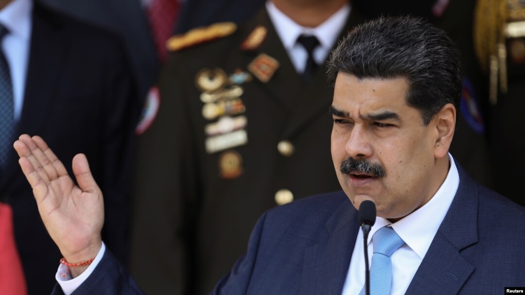FILE - Venezuela's President Nicolas Maduro speaks during a news conference at Miraflores Palace in Caracas, March 12, 2020.