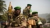 Soldiers from the AU peacekeeping mission prepare to leave at the end of a speech given by Alexandre-Ferdinand Nguendet, the head of Central African Republic's transitional assembly at the Gendarmerie headquarters in Bangui on Jan. 13, 2014. 