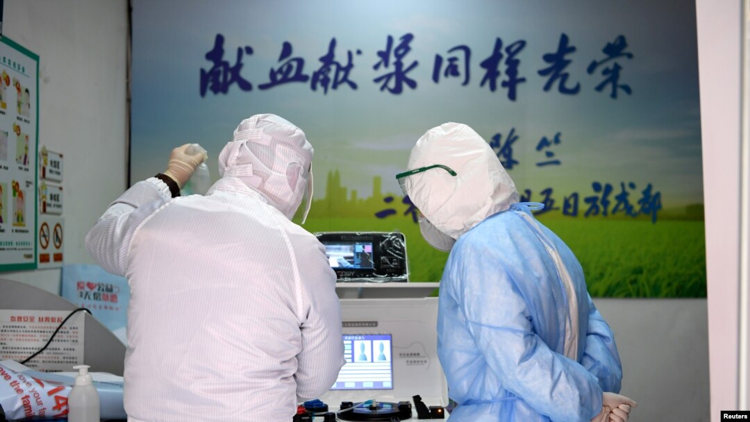 Medical workers in protective suits inspect equipment at a blood donation room of the Renmin Hospital of Wuhan University in Wuhan, the epicenter of the novel coronavirus outbreak, in Hubei province, China Feb. 14, 2020.
