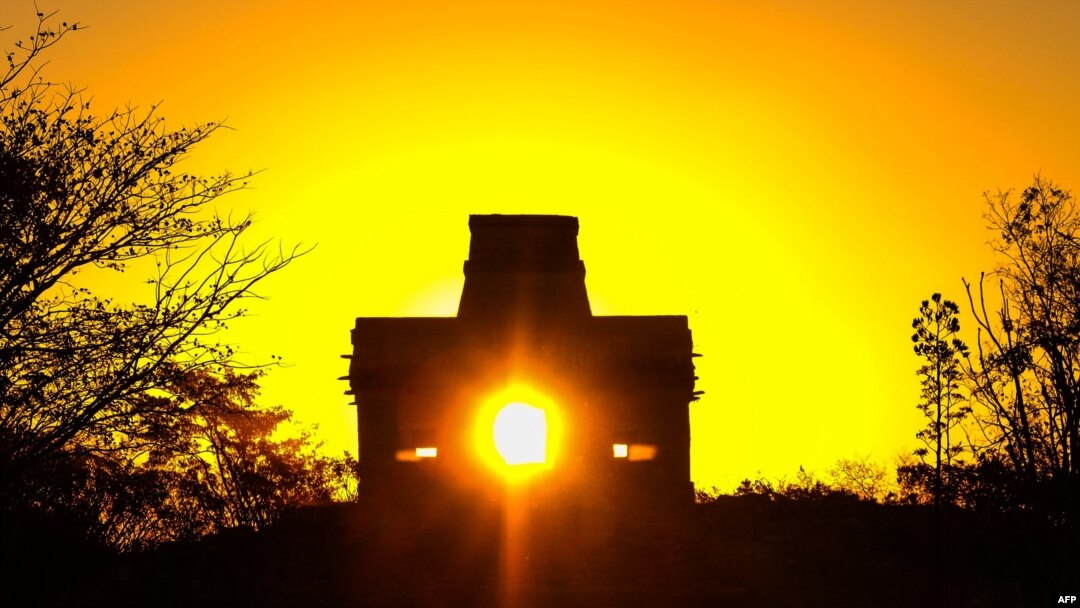 FILE - The sun shines directly through the door of the Seven Dolls Temple, in the Maya Ruins of Dzibilchaltun, in the Mexican state of Yucatan in this March 20, 2017, photo.