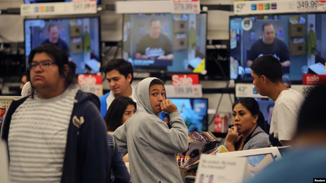 Shoppers stand in a checkout line during Black Friday sales at a Target store in Culver City, California, Nov. 25, 2016.