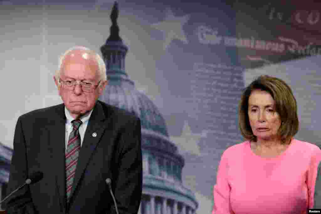 U.S. House Minority Leader Nancy Pelosi (D-CA) and Sen. Bernie Sanders (I-VT) react during a news conference on release of the president&#39;s FY2018 budget proposal on Capitol Hill in Washington, D.C., May 23, 2017.