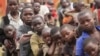 Refugee children displaced by continued fighting in Democratic Republic of Congo's North Kivu province await food, Nyakabande refugee transit camp, Kisoro town, Uganda, July 13, 2012.