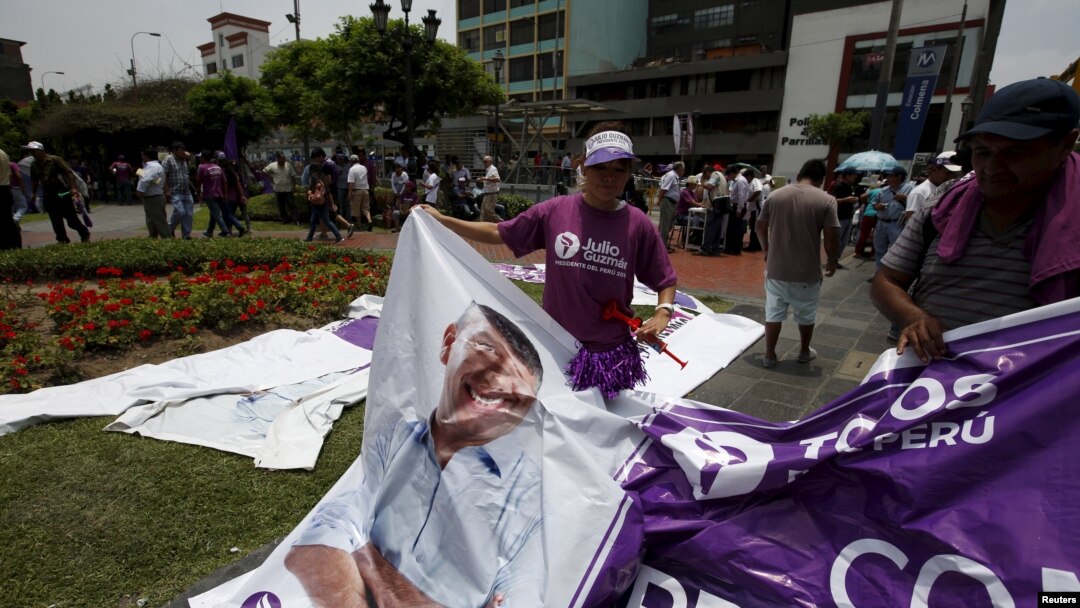 FILE - Supporters of "All for Peru" party's presidential candidate Julio Guzman are seen outside the country's electoral board in Lima, Feb. 16, 2016.