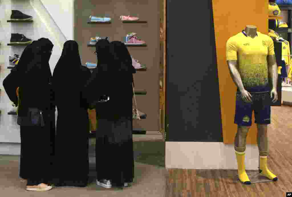 Saudi women shop at a mall in Riyadh. Women across Saudi Arabia marked a historic milestone Saturday, both voting and running as candidates in government elections for the first time.
