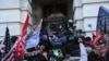 Trump supporters clash with police and security forces as they storm the U.S. Capitol in Washington, Jan. 6, 2021.