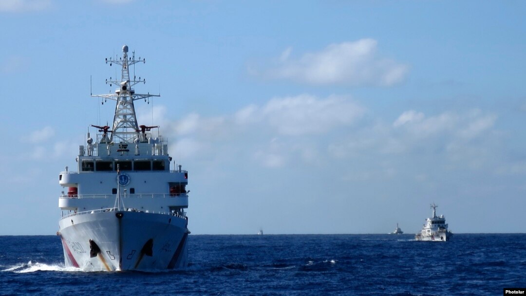 Chinese coastguard ships give chase to Vietnamese coastguard vessels (not pictured) after they came within 10 nautical miles of the Haiyang Shiyou 981, known in Vietnam as HD-981, oil rig in the South China Sea, July 15, 2014.