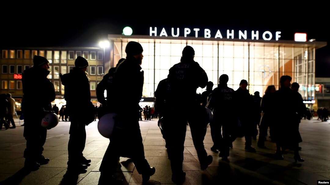 German riot police officers take their possitions near the Hauptbahnhof before New Year celebrations for 2017 in Cologne, Germany, Dec. 31, 2016. 