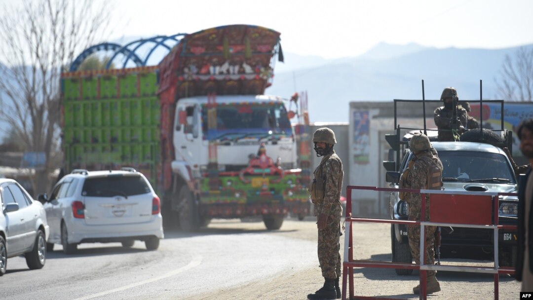 FILE - Pakistani army soldiers stand guard at a checkpoint in in North Waziristan, near the border between Pakistan and Afghanistan, Jan. 27, 2019. A skirmish at a similar checkpoint killed three people Sunday.